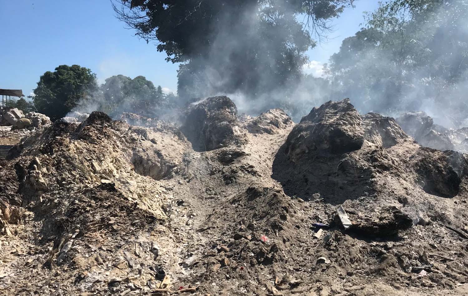 The still smoldering heap of ash after the trash piles of solid waste from the Park caught on fire in 2020.